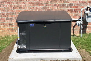Black generator outside a residential home