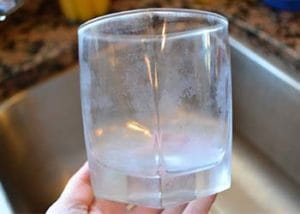 A glass with the telltale residue that results from hard water.