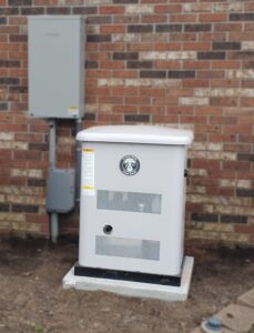 home generator installed outside house with brick walls